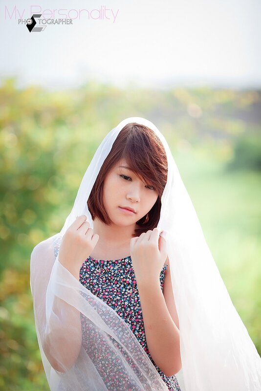 woman with veil in field