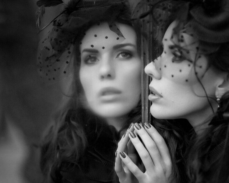 woman with veil in mirror