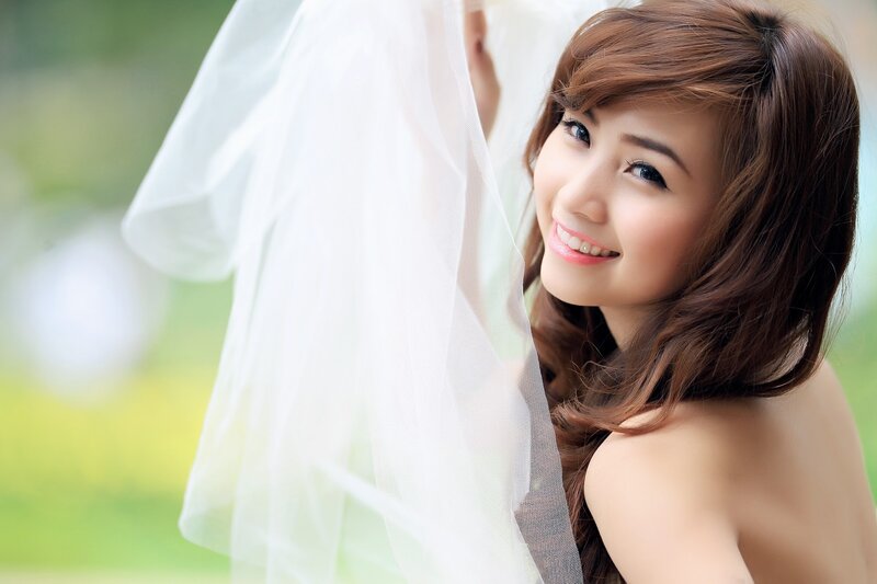 woman with veil smiling