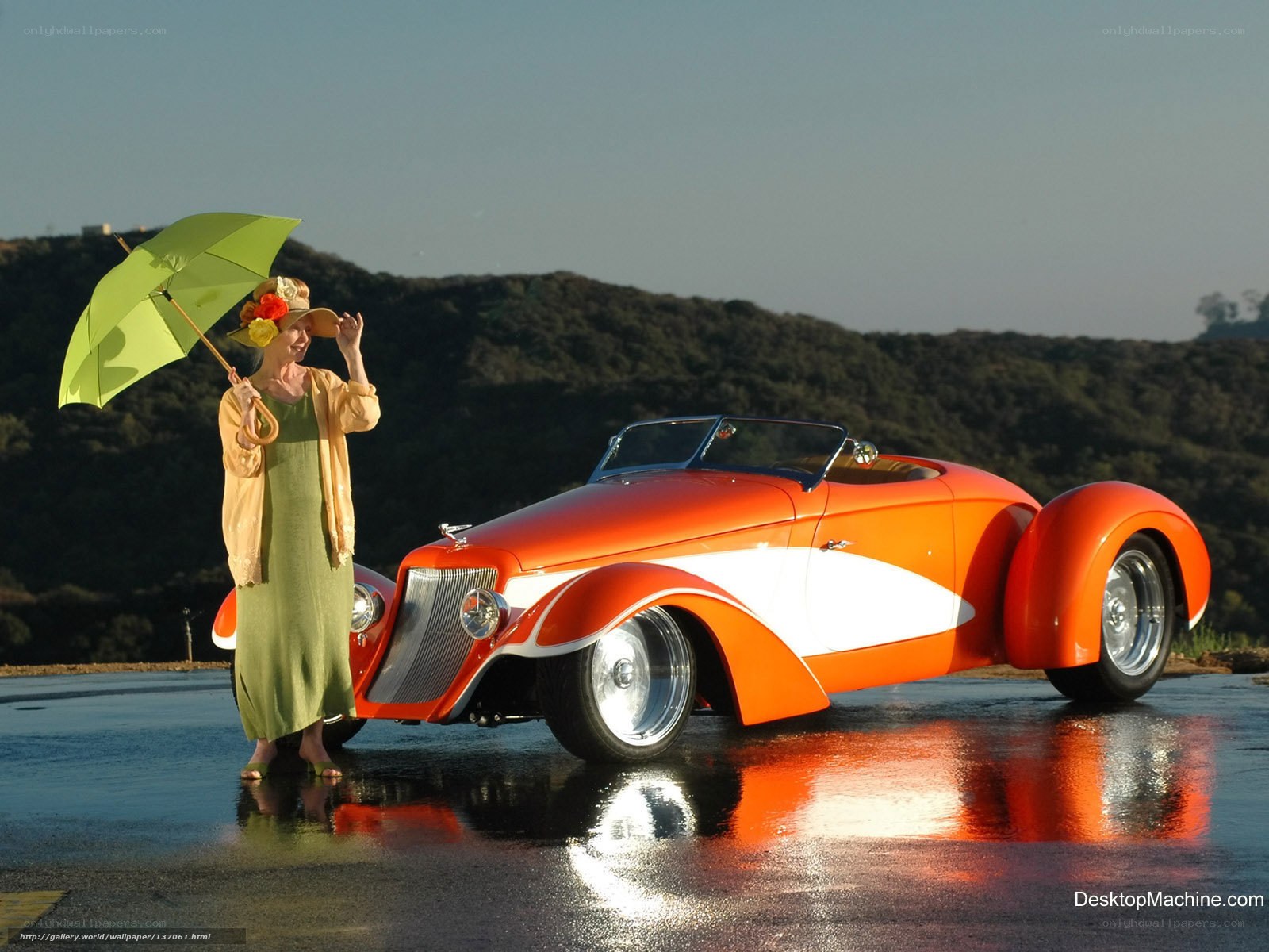 Woman with vintage car and umbrella