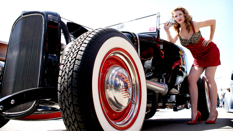 Woman with vintage hot rod