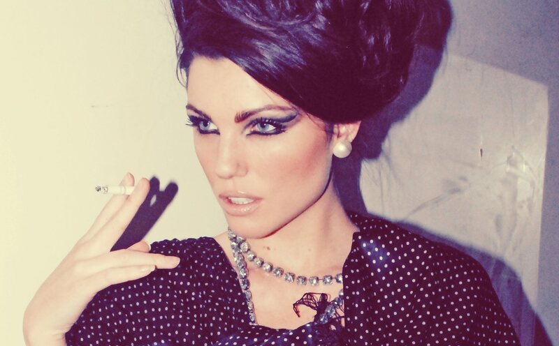 woman with vintage makeup holding cigarette