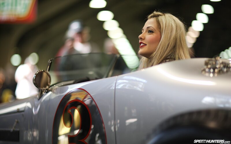 woman with vintage race car