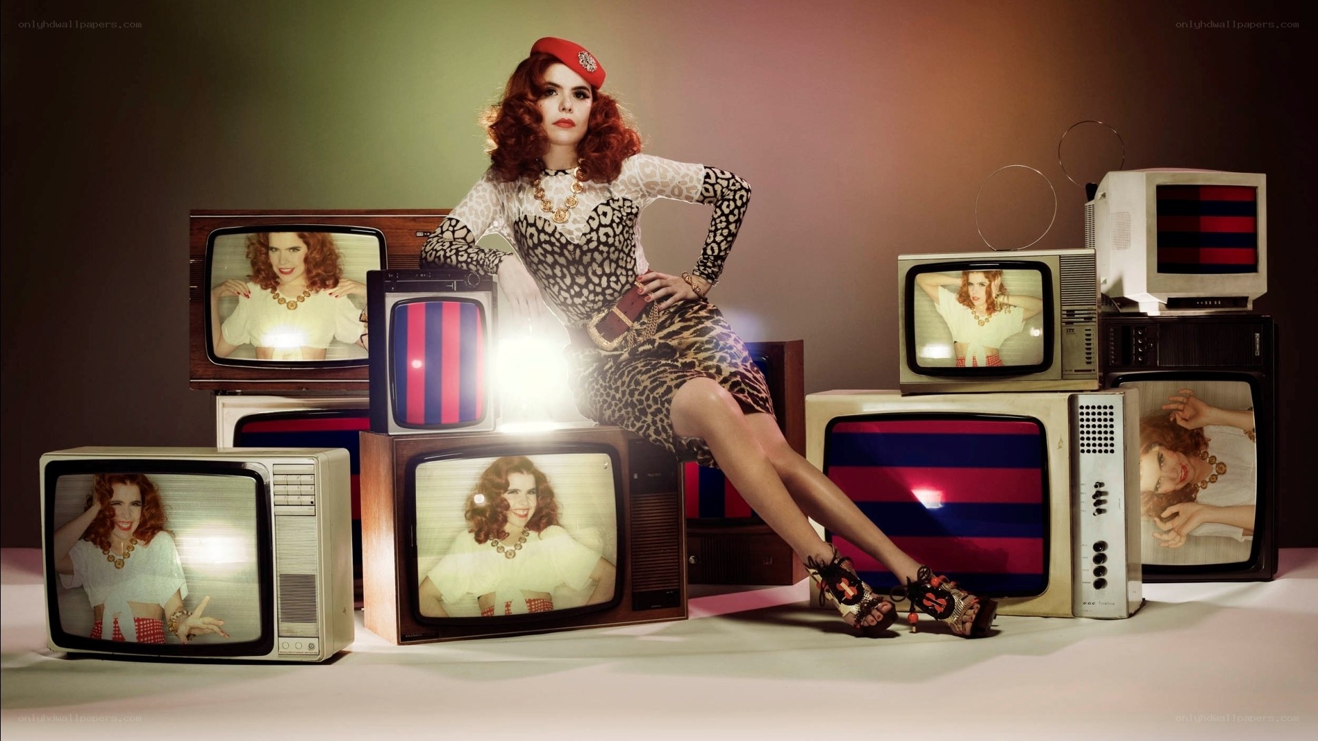 woman with vintage televisions