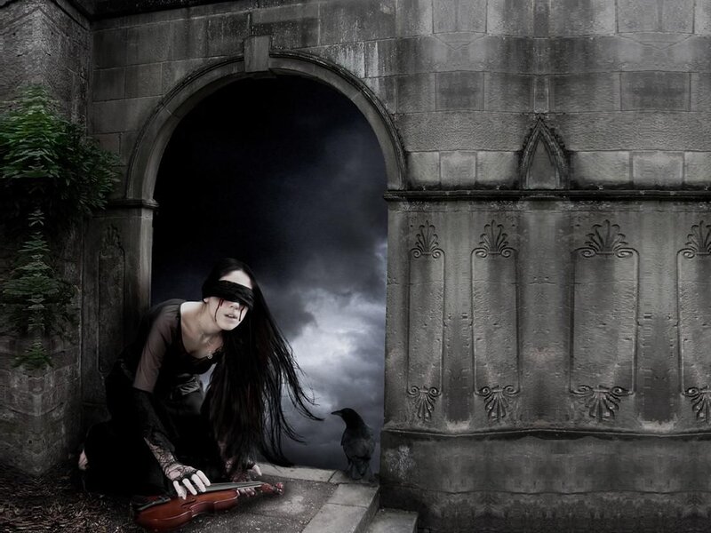 Woman with violin in dark archway