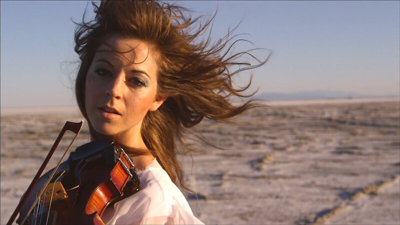 woman with violin in desert