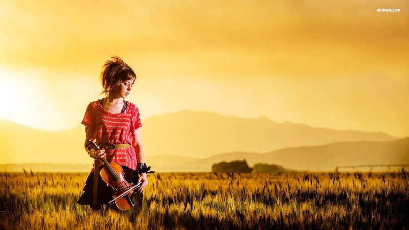 woman with violin in field