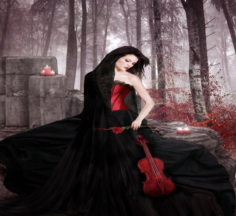 Woman with violin in forest