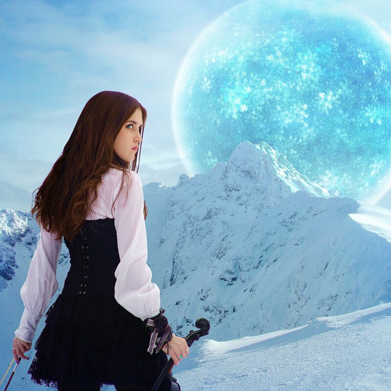 woman with violin in snowy landscape