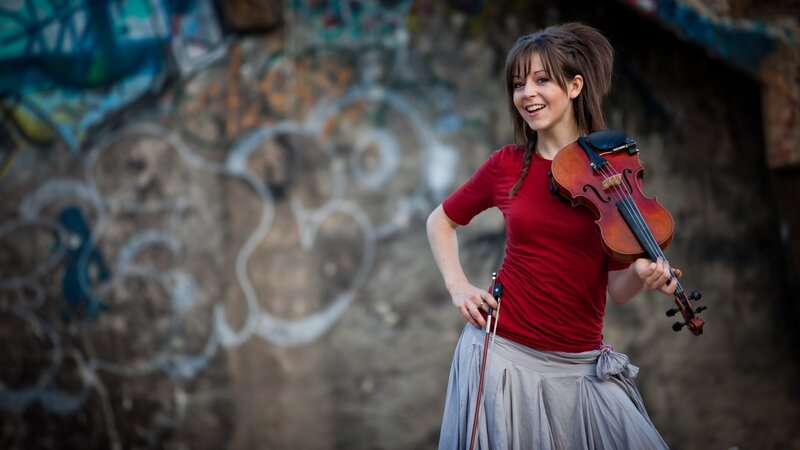 Woman with violin in urban setting