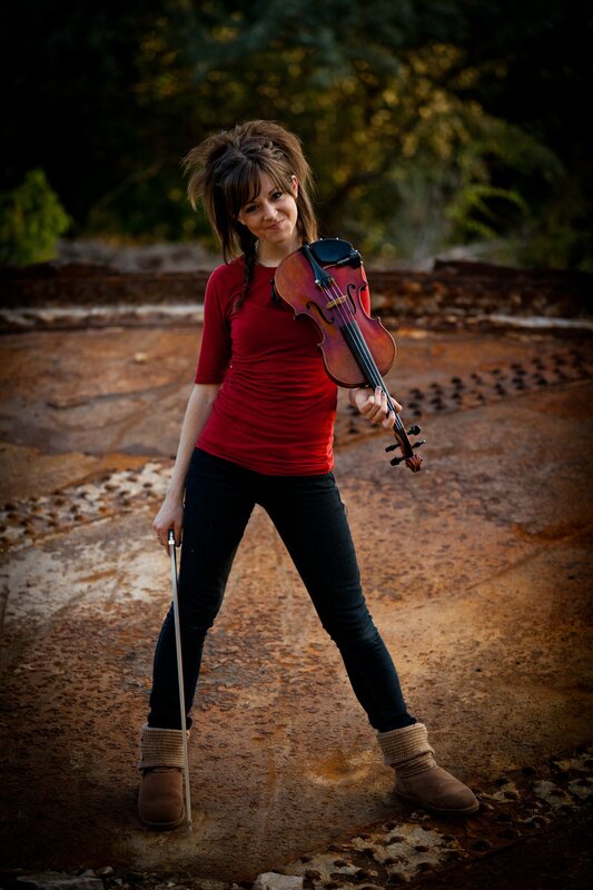 woman with violin outdoors