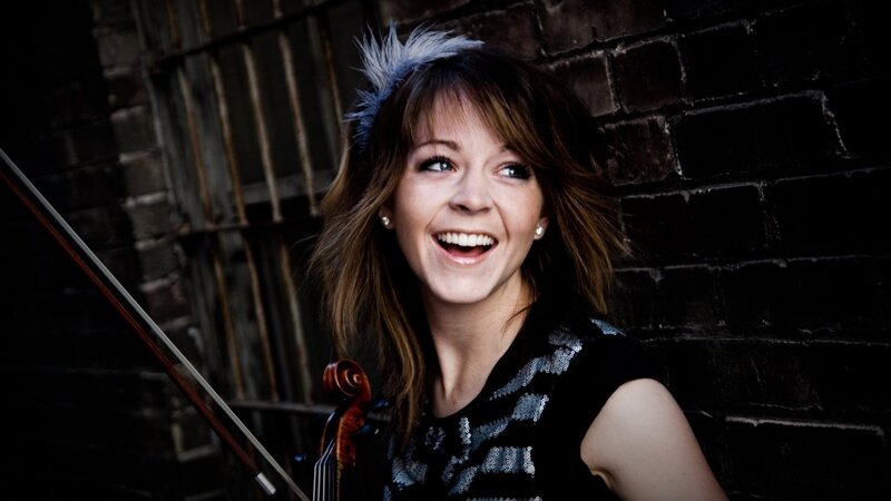 woman with violin smiling