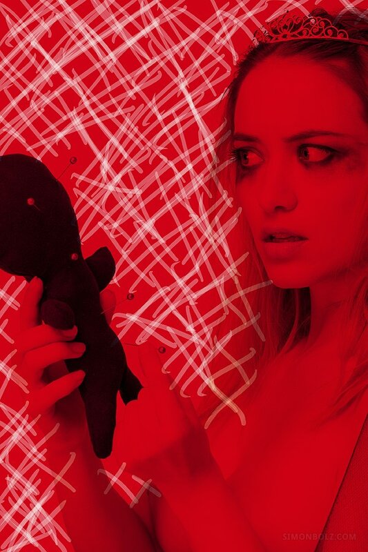 woman with voodoo doll