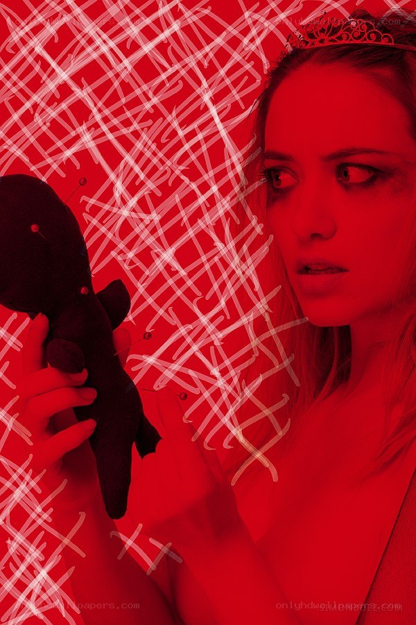 woman with voodoo doll