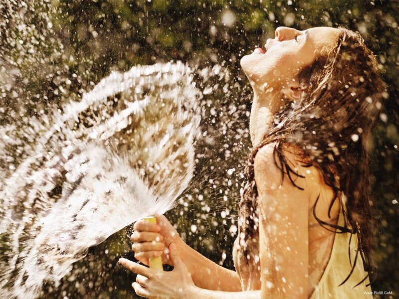 Woman with Water Spray — Yellow