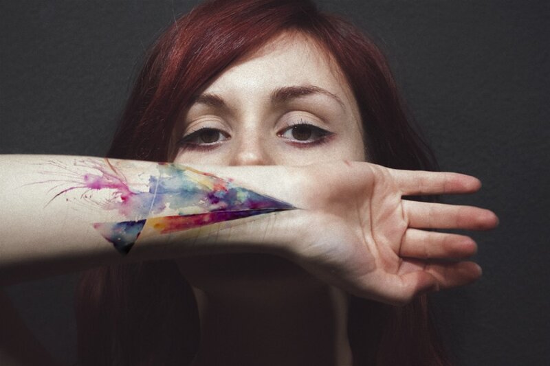 woman with watercolor tattoo