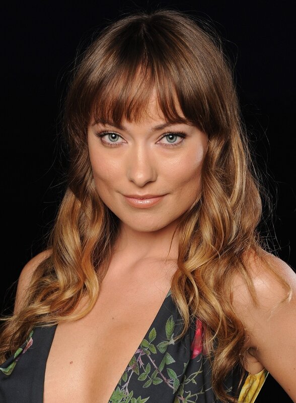 woman with wavy hair and bangs