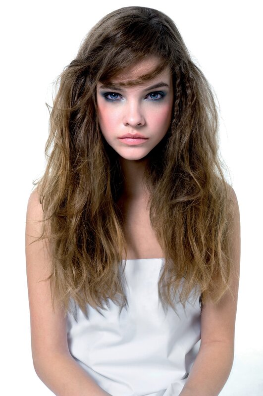 woman with wavy hair and blue eyes