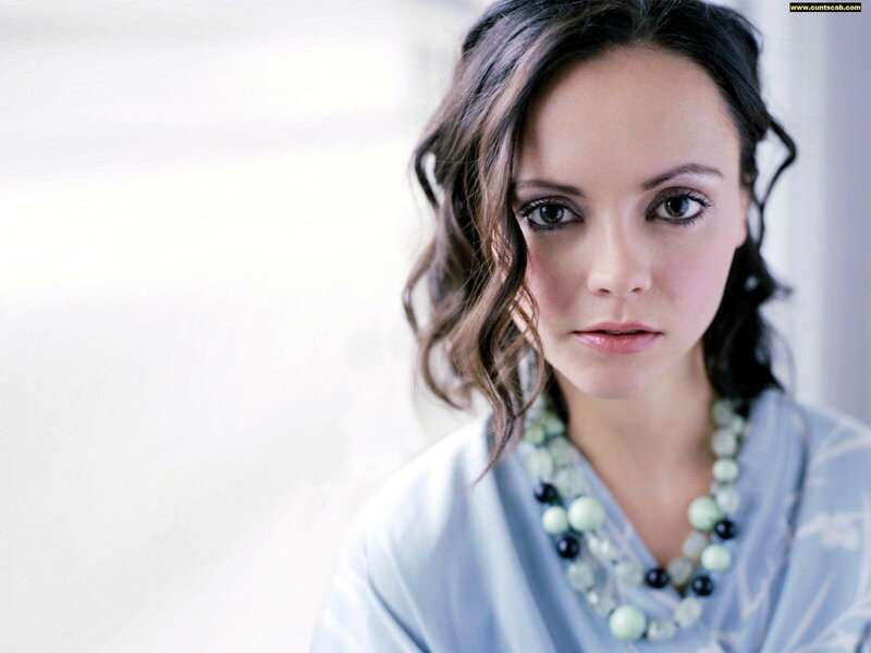 woman with wavy hair and necklace