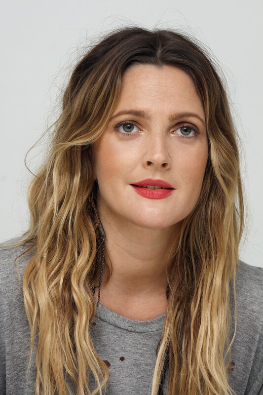 woman with wavy hair and red lipstick