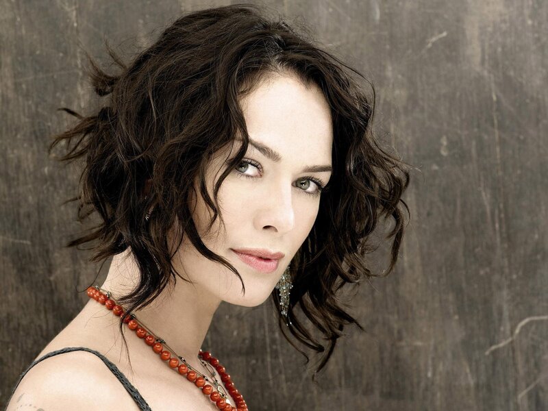 woman with wavy hair and red necklace