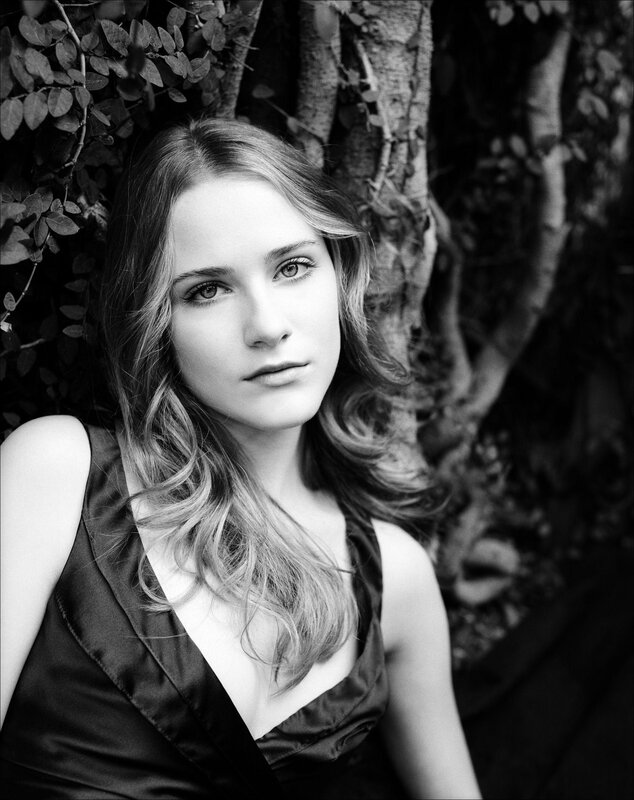 Woman with Wavy Hair — Black, Serious, Photograph, Tree