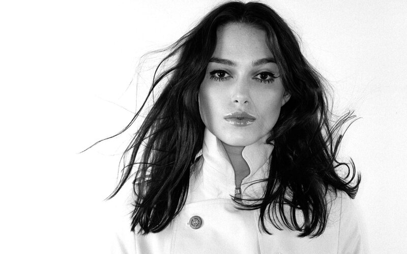 woman with wavy hair in black and white
