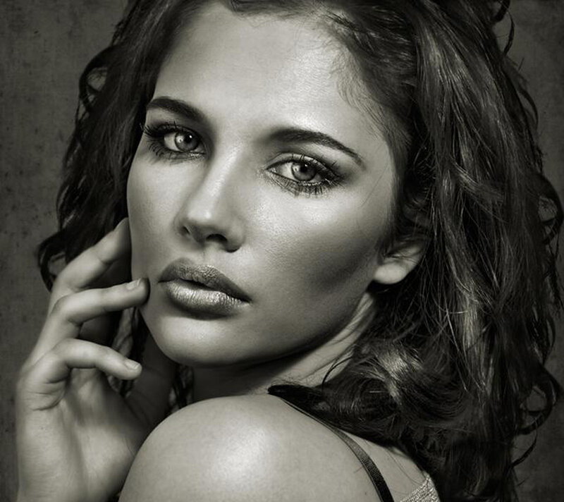 woman with wavy hair in black and white