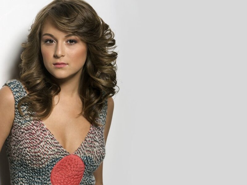 woman with wavy hair in patterned top