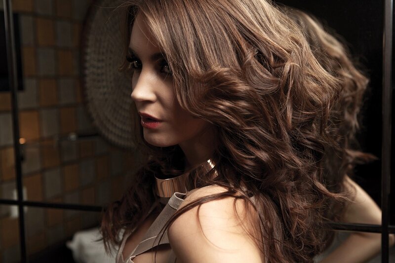 woman with wavy hair in studio