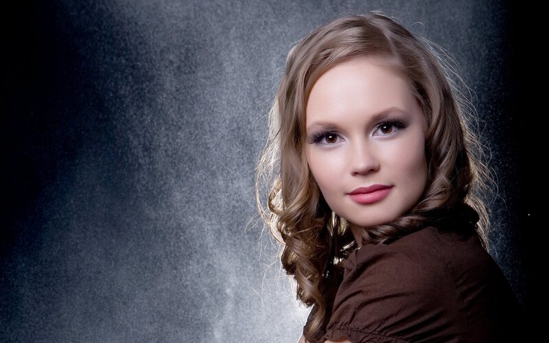 woman with wavy hair in studio