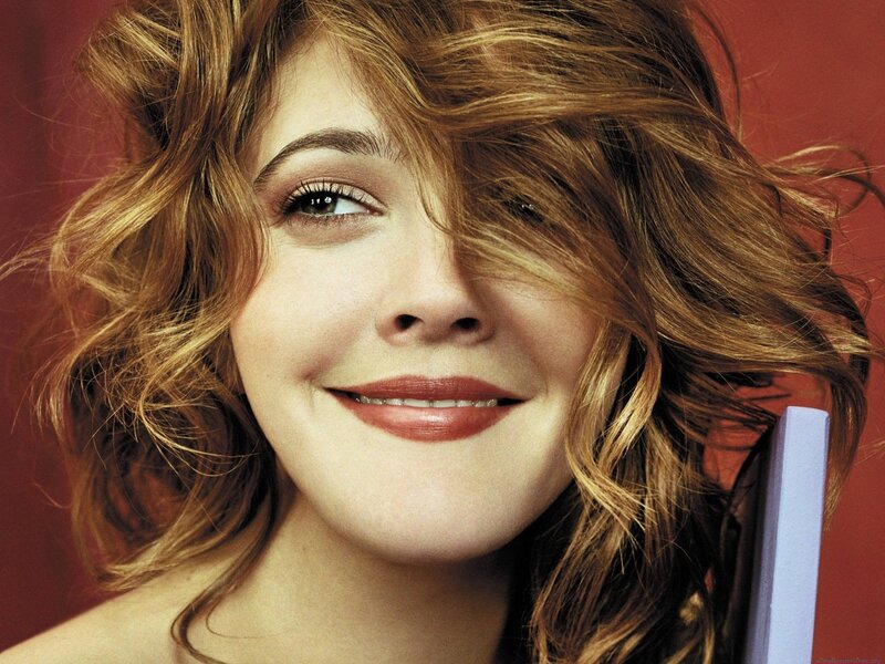 woman with wavy hair smiling
