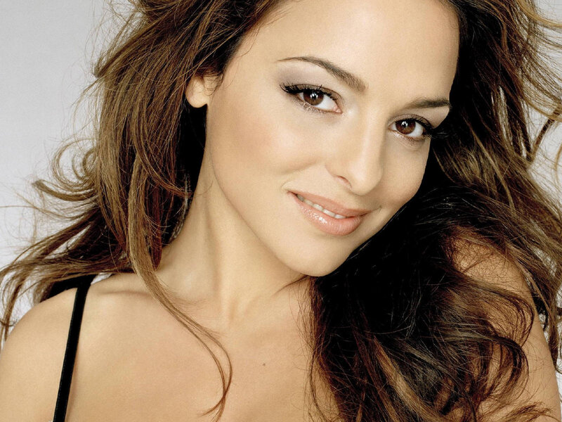 woman with wavy hair smiling