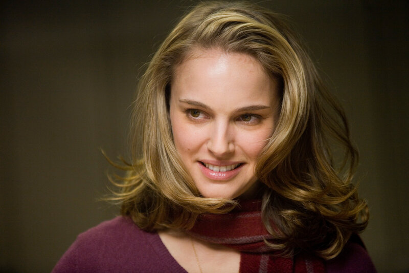 woman with wavy hair smiling