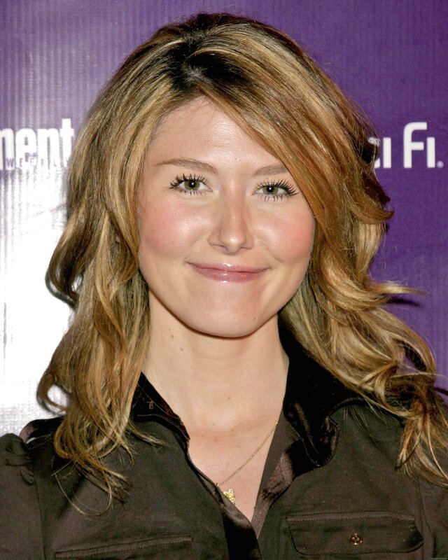 woman with wavy hair smiling