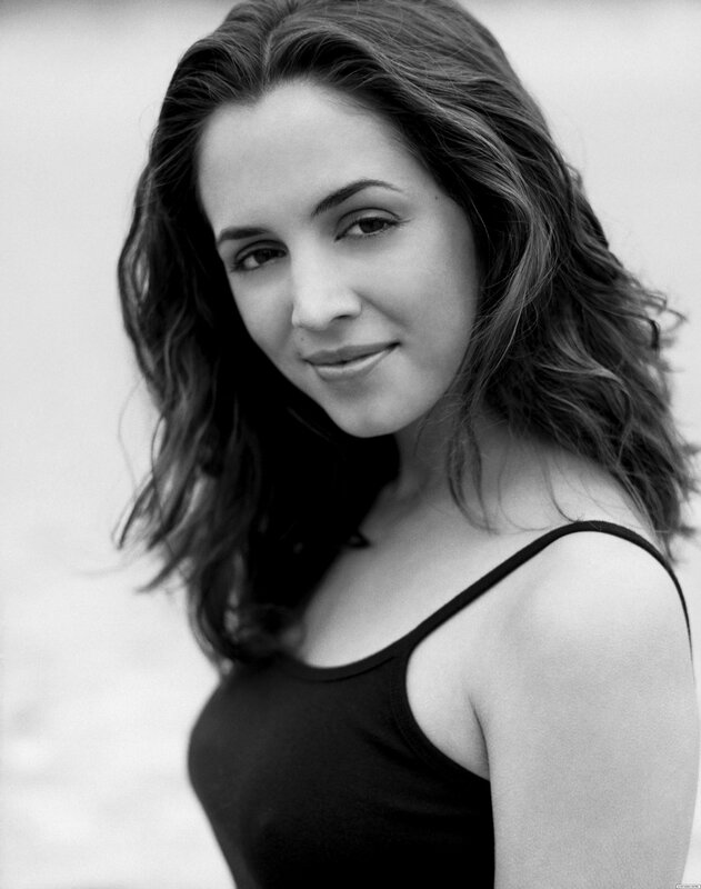 woman with wavy hair smiling