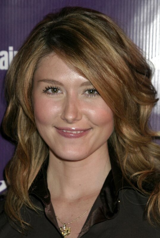 woman with wavy hair smiling