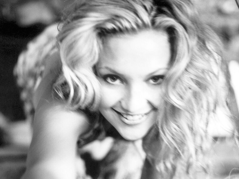 woman with wavy hair smiling