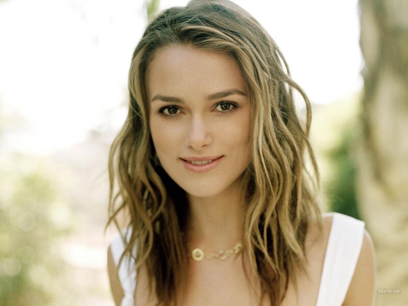 woman with wavy hair smiling