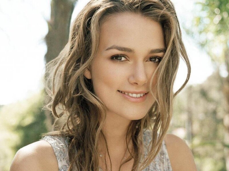 woman with wavy hair smiling
