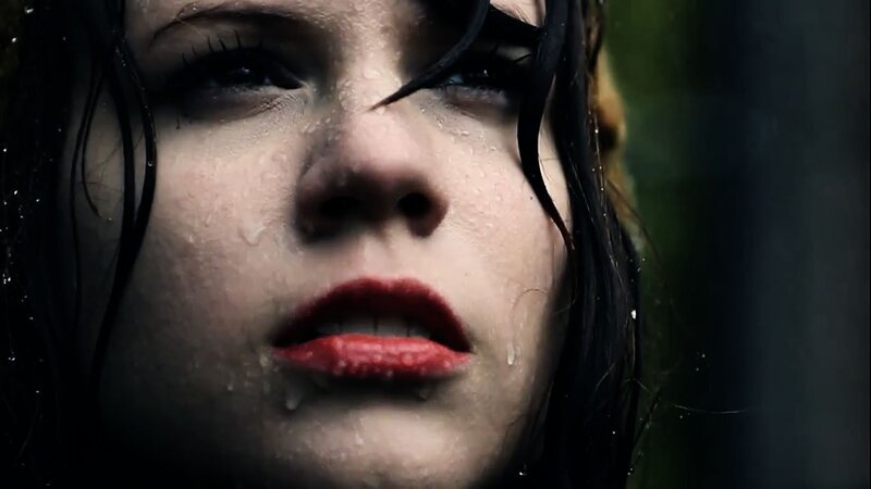 woman with wet face in rain