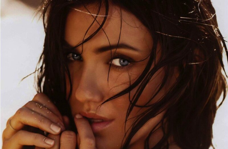 woman with wet hair and blue eyes