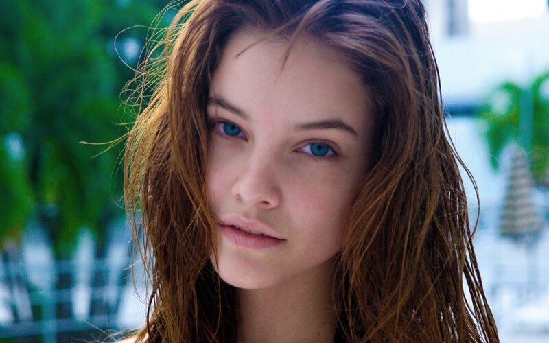 woman with wet hair and blue eyes