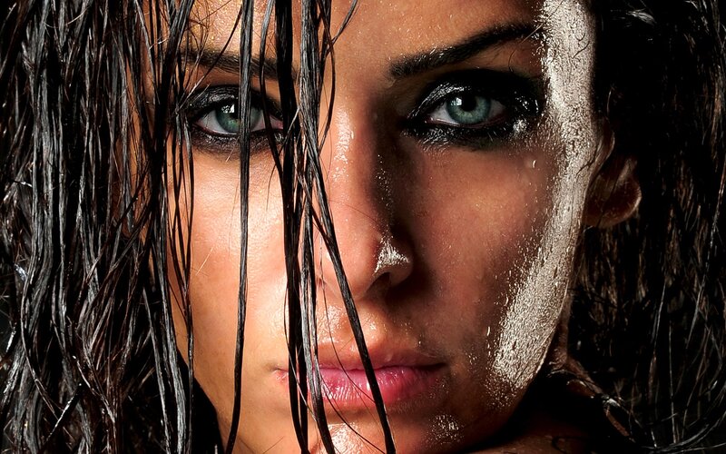 woman with wet hair and green eyes