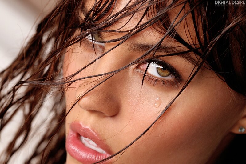 woman with wet hair and tear