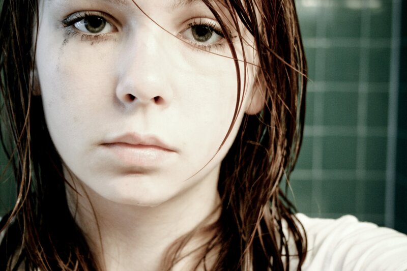 woman with wet hair in bathroom