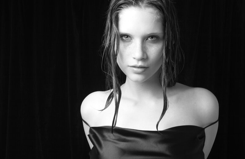 woman with wet hair in black and white