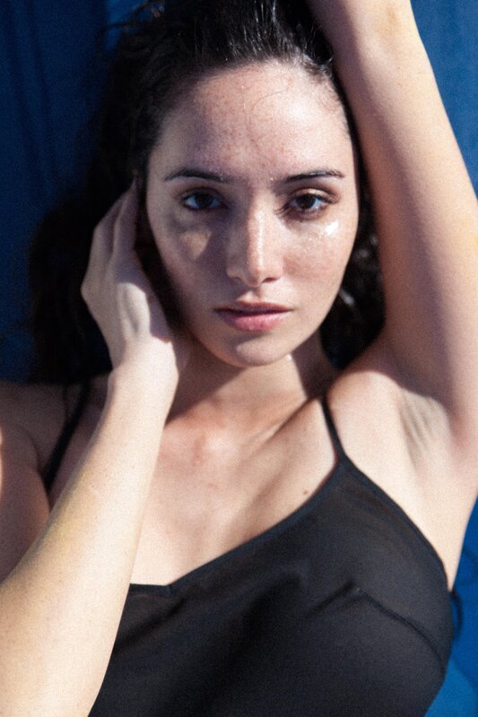 woman with wet hair in black top