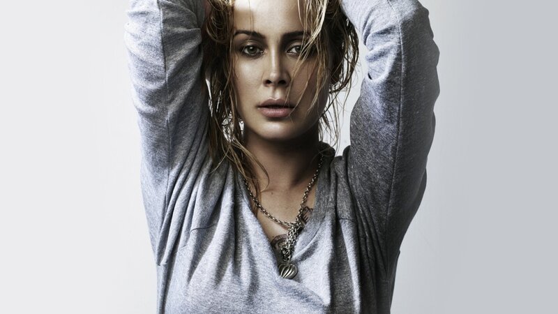 woman with wet hair in gray shirt