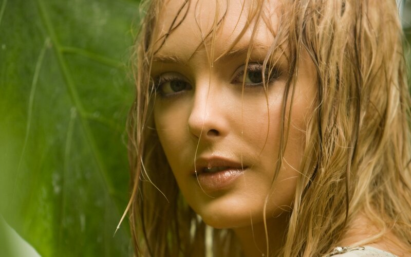 woman with wet hair in green setting